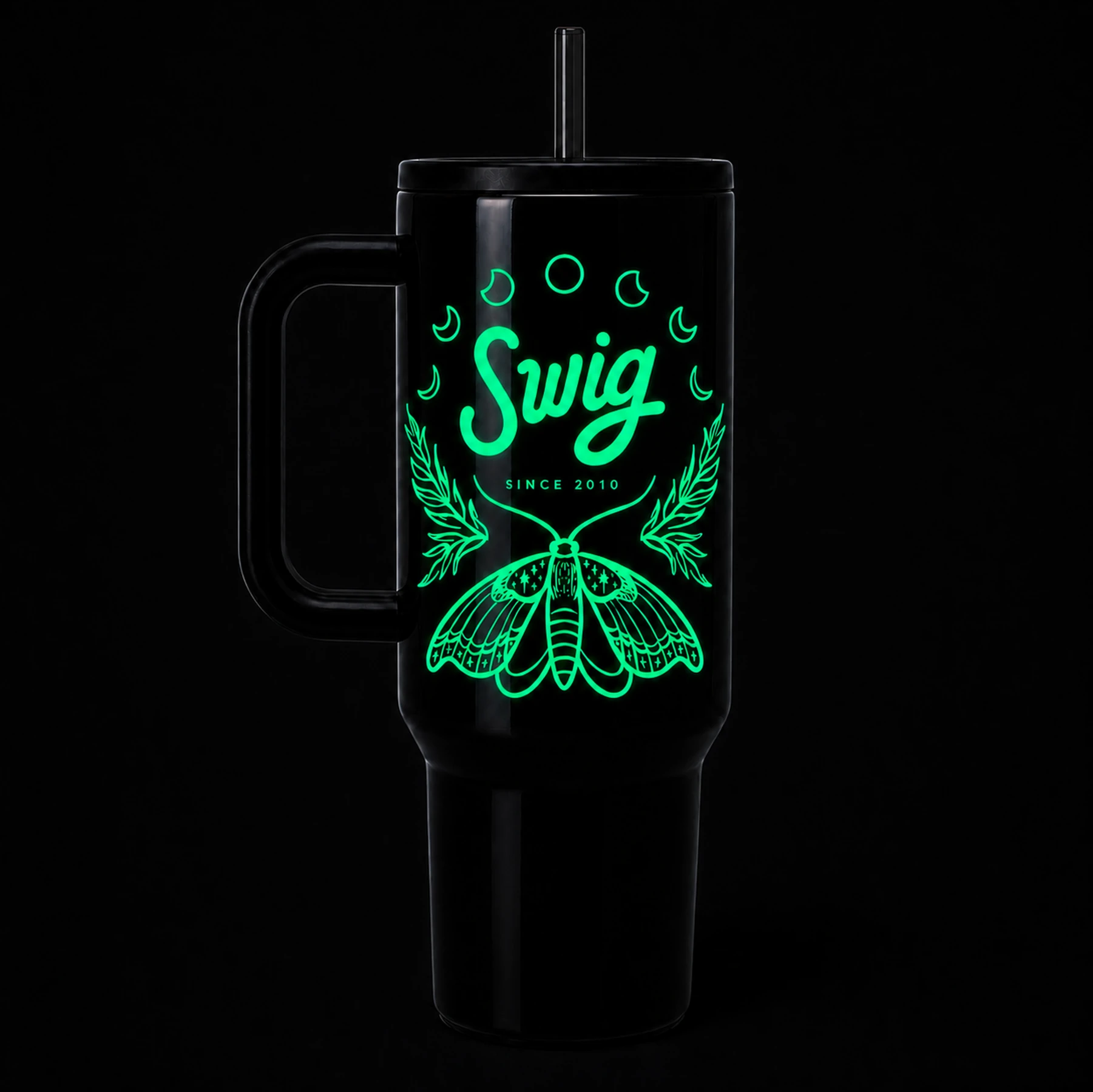 The moth design glowing green in darkness